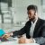 african-american-man-customer-support-operator-with-hands-free-headset-working-office
